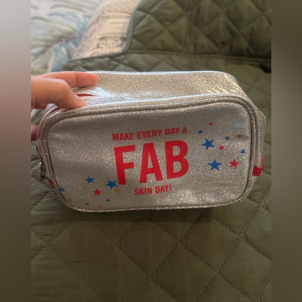 First Aid Beauty Cosmetic Bag Silver Glitter Makeup Bag with Red and Blue Stars